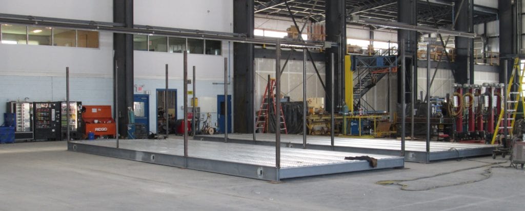 two-modular-steel-frames-in-a-controlled-manufacturing-facility two-modular-steel-frames-in-a-controlled-manufacturing-facility